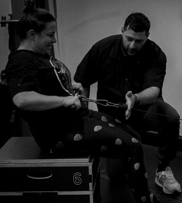 client working hard with the trainer in Caldwell private gym