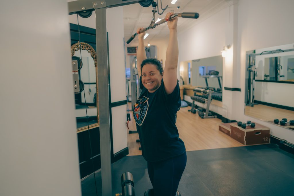 a woman doing back exercise wide shot